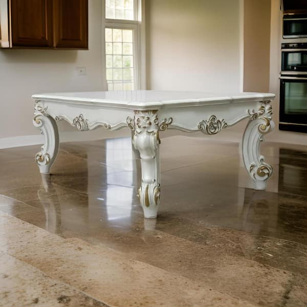 Benjara Jess 53 in. White and Gold Rectangle Wood Coffee Table with Oversized Scrolled Legs For Stability And Elegance