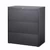 Charcoal metal three-drawer lateral file cabinet on plain background.