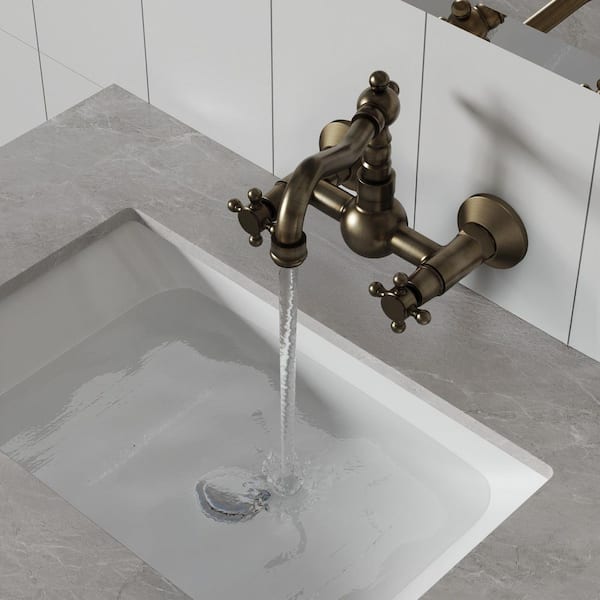 British Vintage Style Double Handle Wall Mounted Bathroom Faucet in Antique Brass Drain Not Included