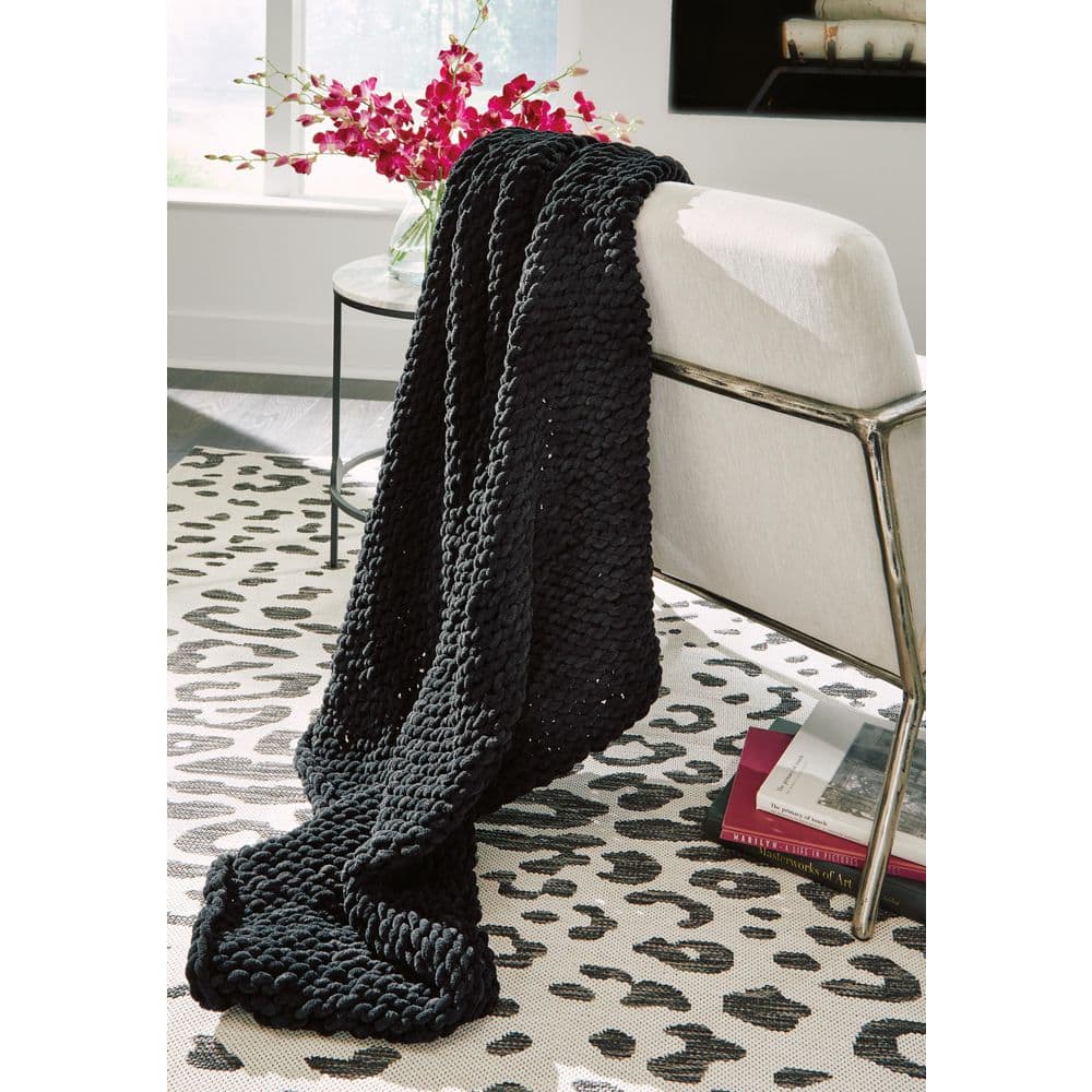 Signature DESIGN BY ASHLEY Chaddon Black Textured Polyester Throw