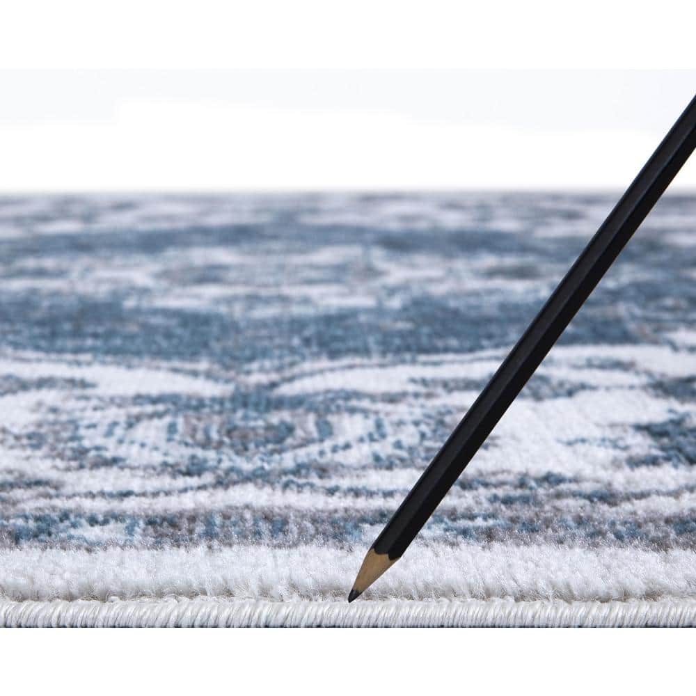 Ivory and Blue Synthetic Medium Pile 5' x 7' Area Rug