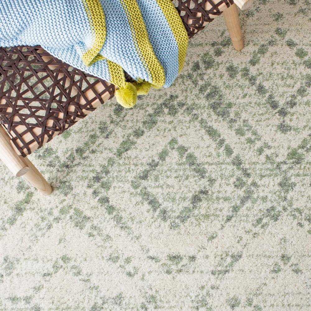 Ivory and Green Geometric 10' x 14' Synthetic Area Rug