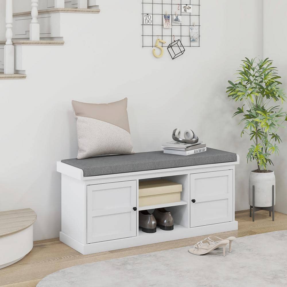 White Wood Storage Bench with Gray Cushion and Cabinets