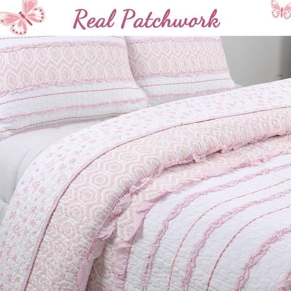 white and pink quilt