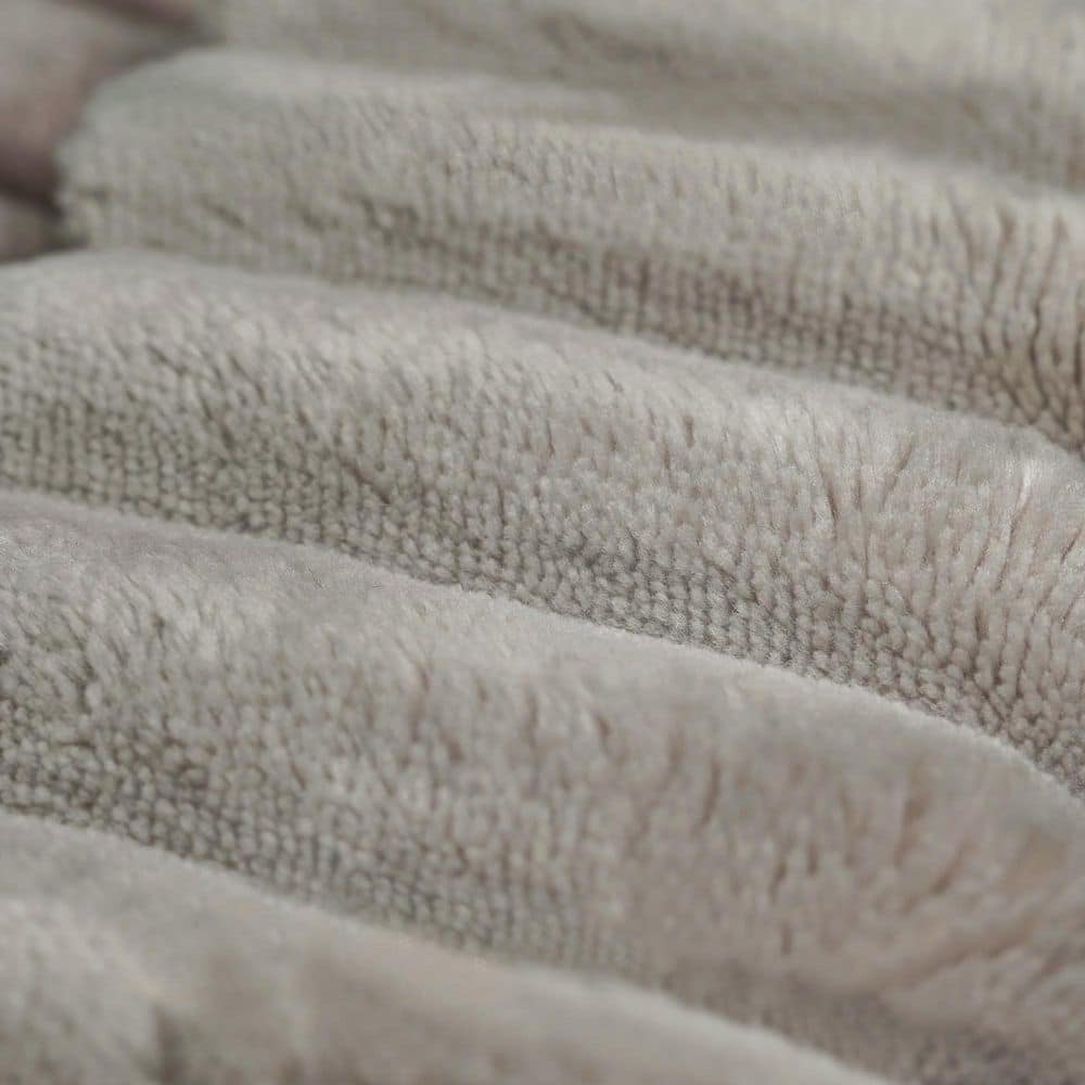 Close-up detail of the textured corduroy upholstery on a sofa.