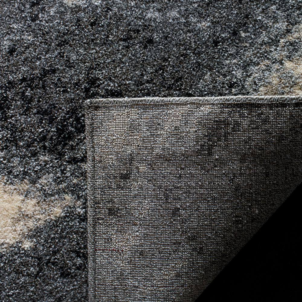 Grey and Ivory Abstract Synthetic Area Rug