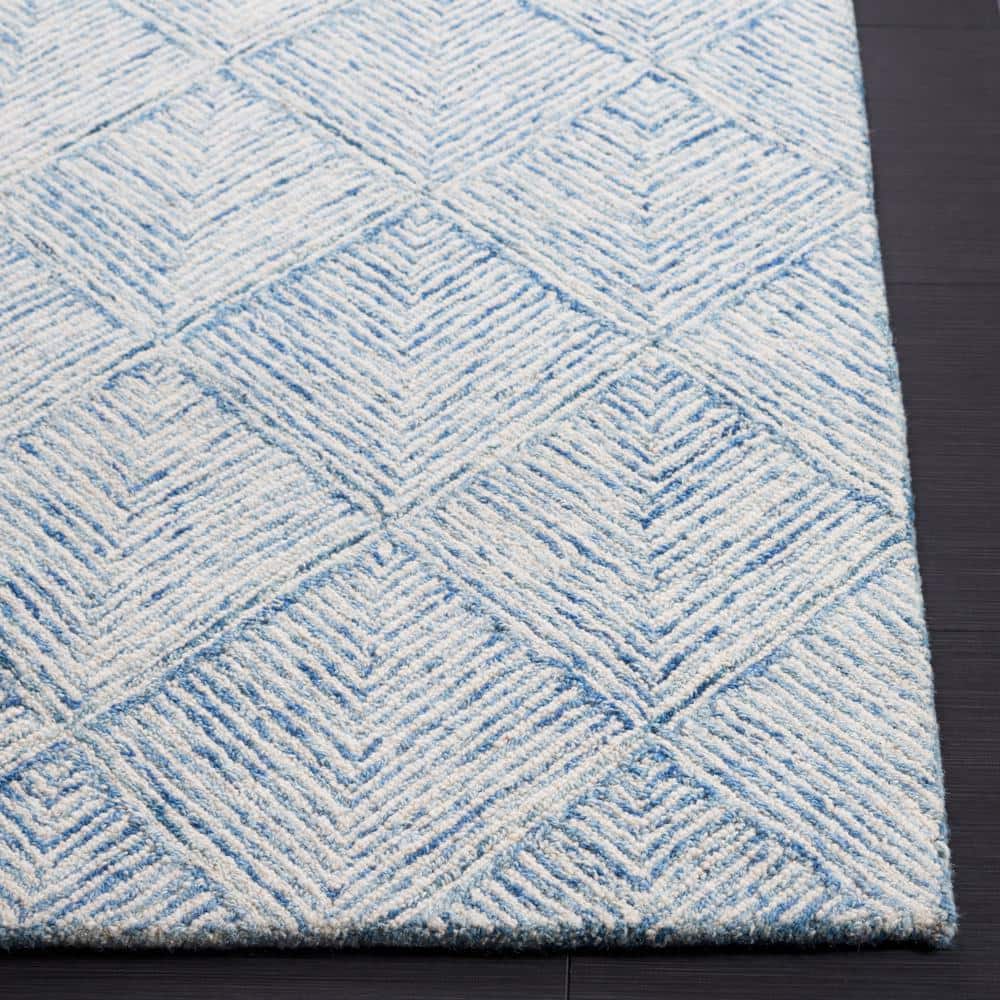Handmade Blue and Ivory Wool Abstract Tufted Area Rug 5' x 8'