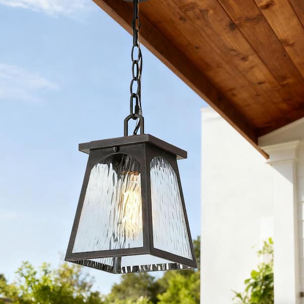 LNC 11 in. 1-light Rusty Bronze Geometric Outdoor Pendant Light with Rippled Glass Hanging Lantern for Covered Outdoor Areas