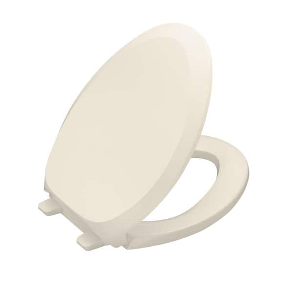 Kohler French Curve Elongated Quiet Closed Toilet Seat In Almond K 4713 47 The Home Depot - Kohler Toilet Seat Replacement Home Depot
