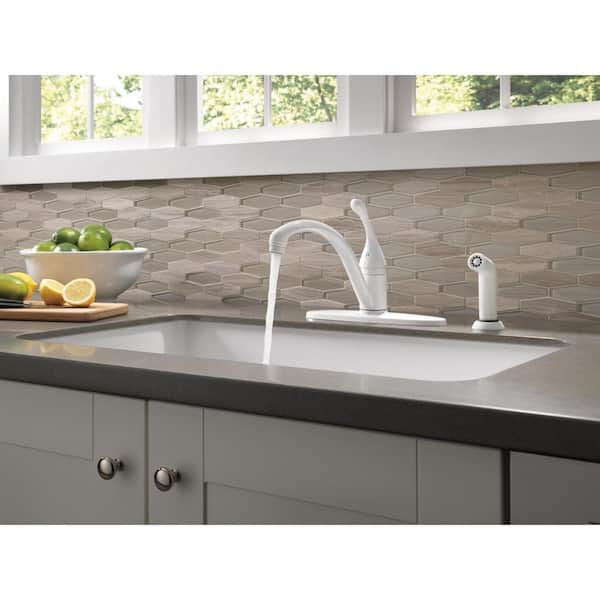 https://images.thdstatic.com/productImages/bf87cd90-eeab-45ef-a202-e78515cdd35b/svn/white-delta-standard-kitchen-faucets-440-wh-dst-1d_600.jpg