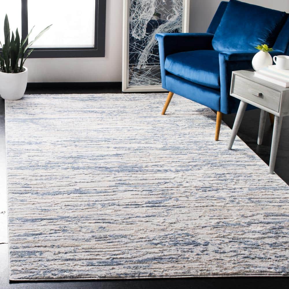 Ivory and Blue Abstract Synthetic Area Rug, 3' x 5'