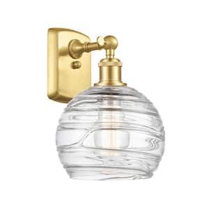Athens Deco Swirl 1-Light Satin Gold Wall Sconce with Clear Deco Swirl Glass Shade