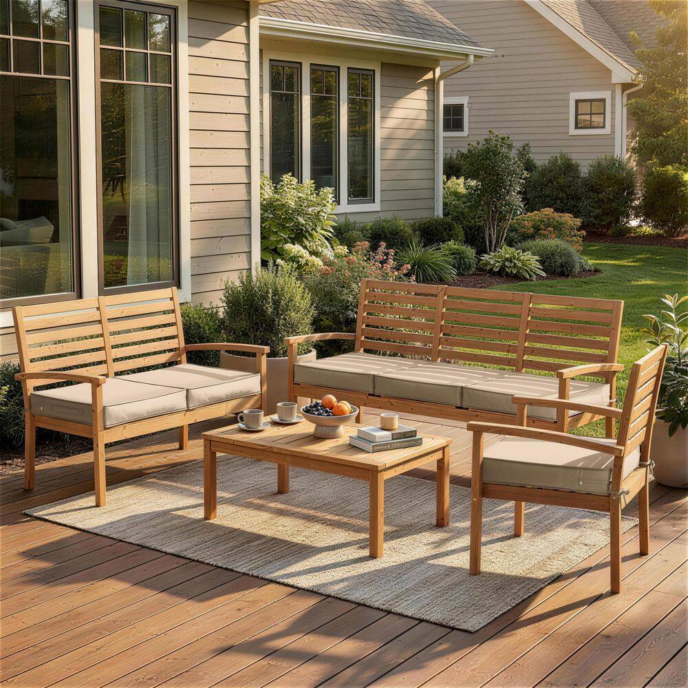 Outdoor wooden furniture set with sand-colored seat cushions.