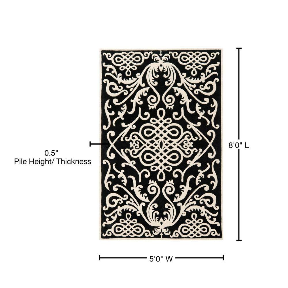 Handmade Black and Ivory Wool Viscose Tufted Area Rug
