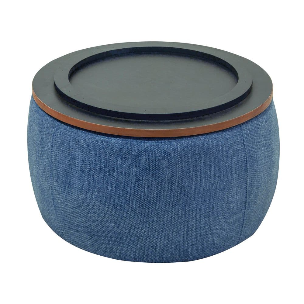 Round storage ottoman with dark grey top and navy blue linen.