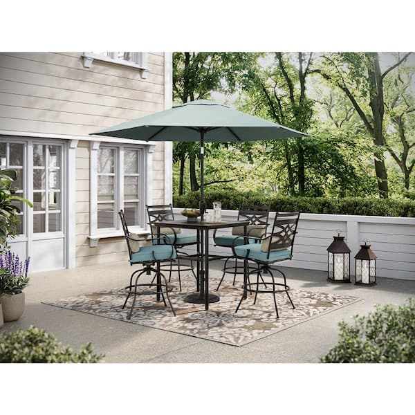 Hanover Montclair 5-Piece Steel Outdoor Dining Set with Ocean Blue Cushions, 4 Swivel Chairs, 33 in. Table and Umbrella