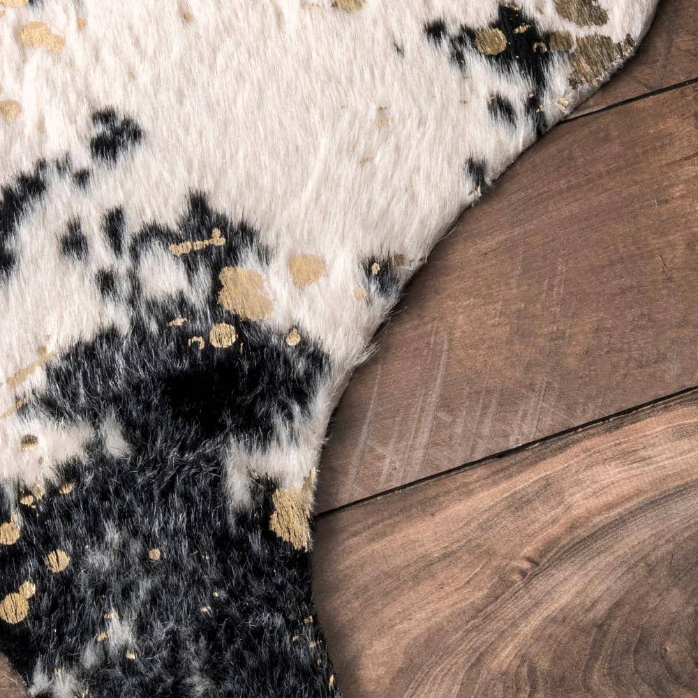 Black and Ivory Tufted Synthetic Cowhide Shaped Area Rug
