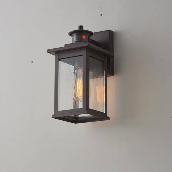 Unbranded 11.75 in. H Outdoor Oil Rubbed Bronze Motion Sensor Dask to Dawn Lantern Sconce with Clear Seeded Glass Shade