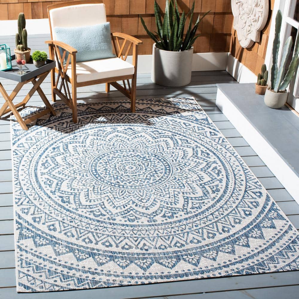 Ivory and Navy Geometric Round Synthetic Area Rug