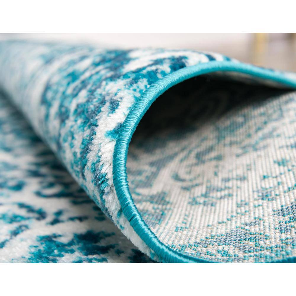 Turquoise and Ivory Geometric Synthetic Area Rug