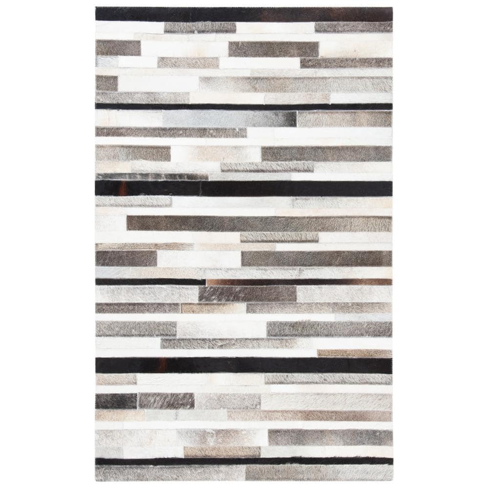 Handmade Black and Ivory Geometric Cowhide Area Rug