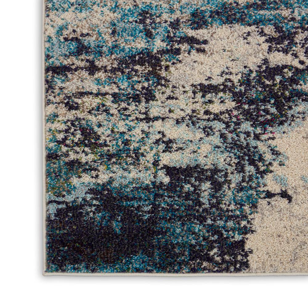 Ivory and Teal Blue Abstract 6' x 9' Synthetic Area Rug