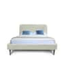 Front view of a white velvet upholstered platform bed with black legs.