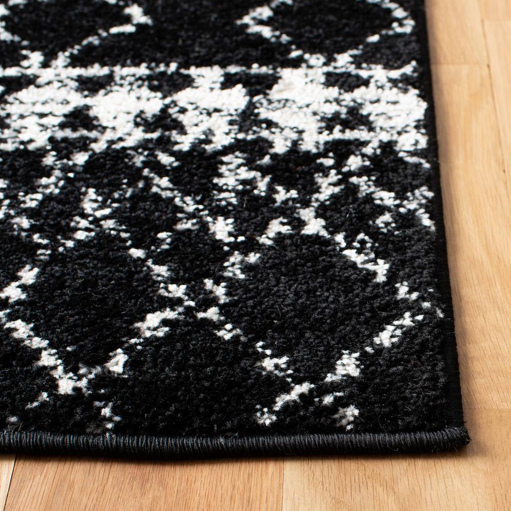 Boho-Chic Black/Ivory Synthetic 6' x 9' Hand-Knotted Area Rug