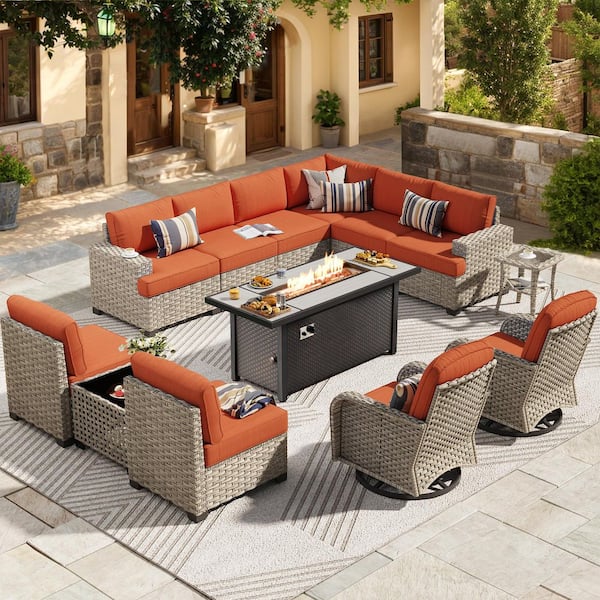 Reverie 13 Pieces Wicker Outdoor Patio Rectangular Fire Pit Set and Swivel Rocking Chairs with Orange Red Cushions