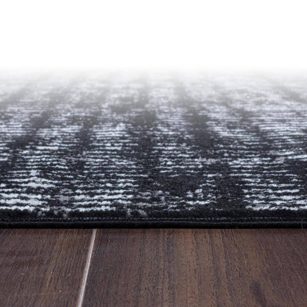 Black and Ivory Geometric Polypropylene Area Rug 2' x 7'