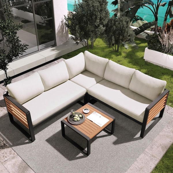4 Pieces Black Metal Patio Conversation Set with Beige Cushions, 1 Coffee Table