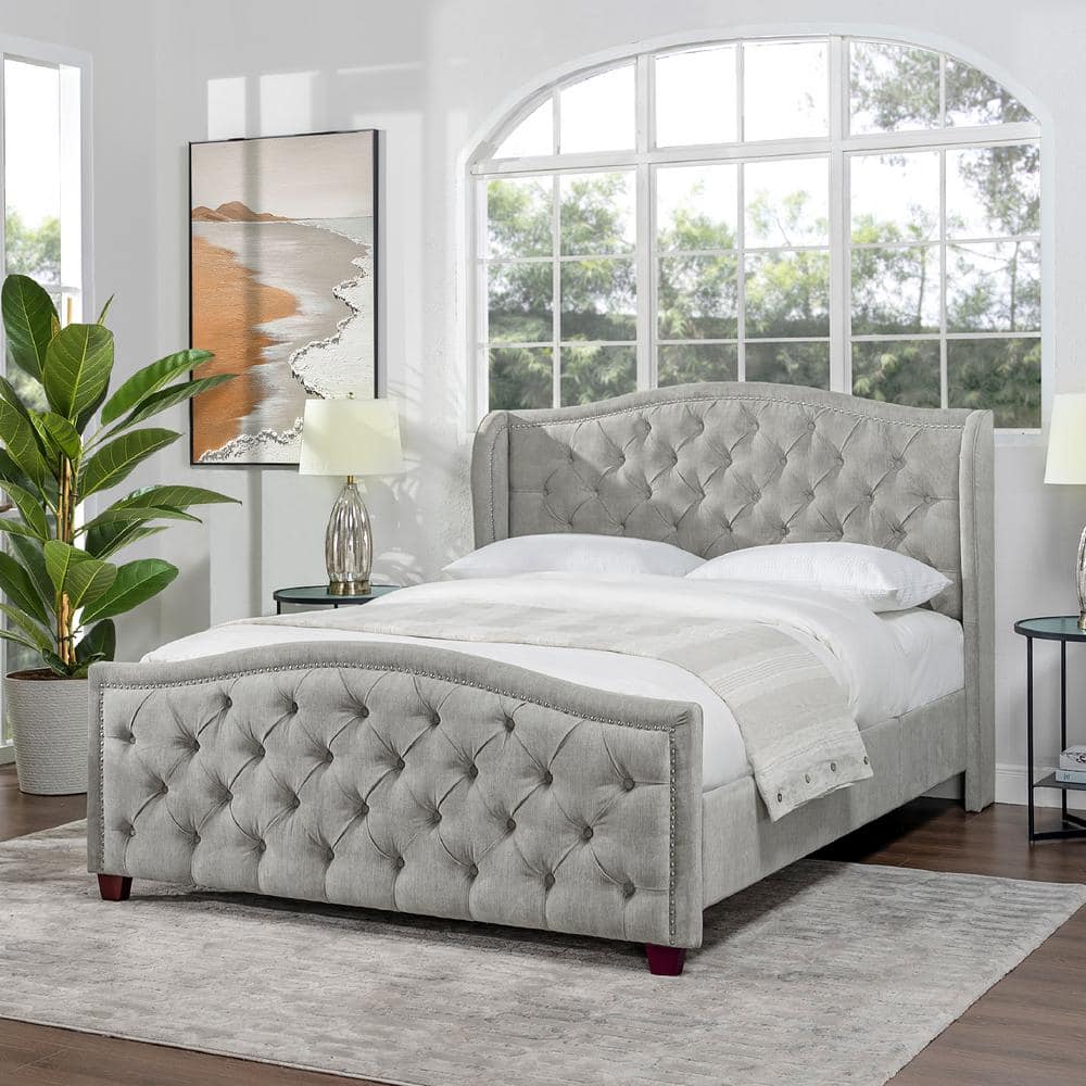 Gray upholstered store wingback bed