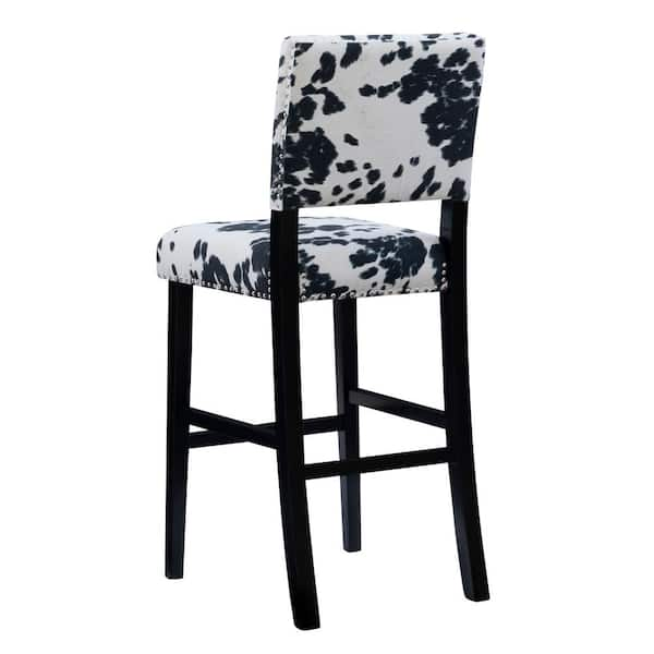 black and white cow print bar stools