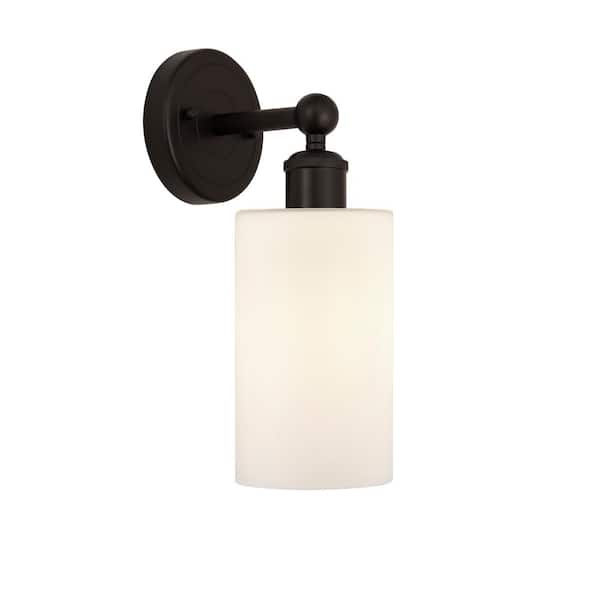 Clymer 1-Light Oil Rubbed Bronze, Matte White Wall Sconce with White Glass Shade