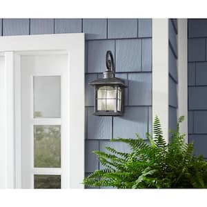Brimfield 14.2 in. Aged Iron 1 Light Outdoor Wall Lantern with Clear Seedy Glass Shade and 220  Motion Sensing