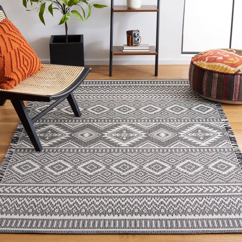 Augustine Black and Ivory Geometric Synthetic Area Rug, 6'4" x 9'6"