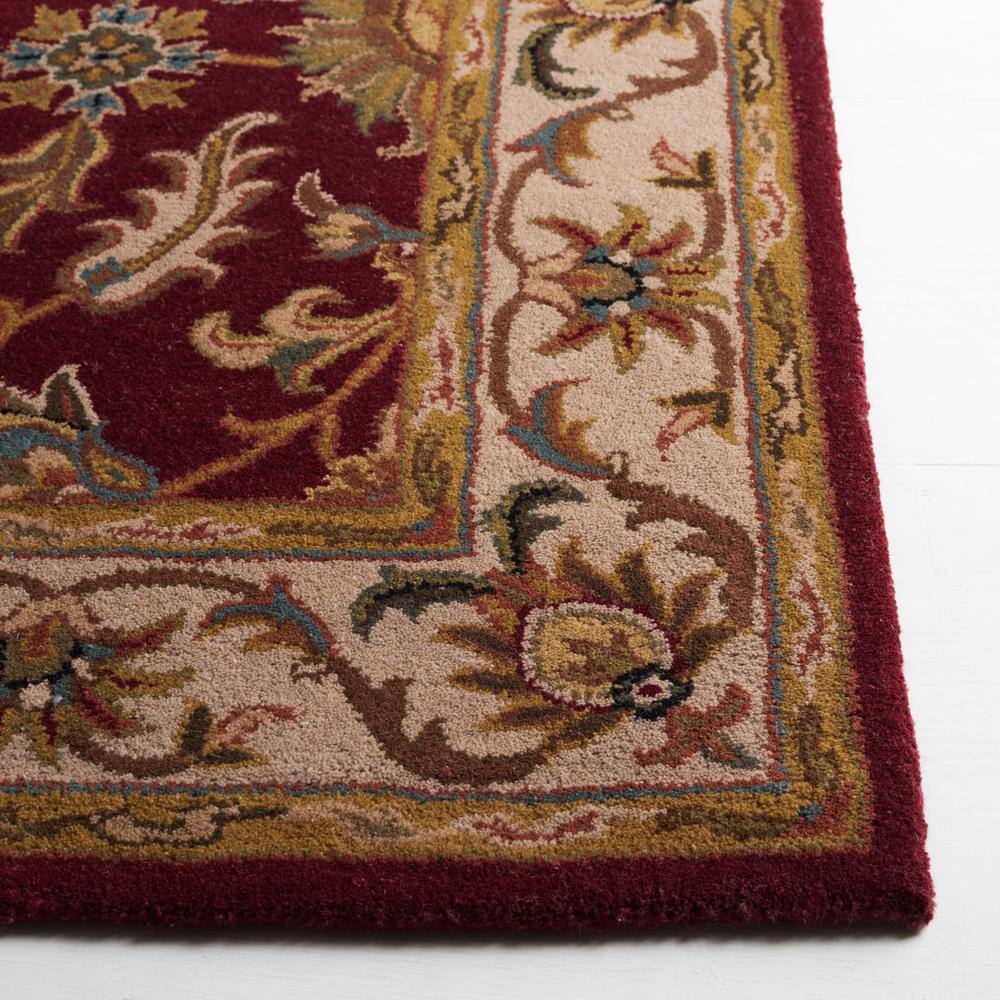 Hand-Tufted Red and Ivory Wool Oval Area Rug 8' x 10'