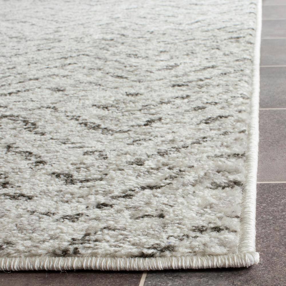 Ivory Charm Hand-Knotted Easy-Care Synthetic Area Rug