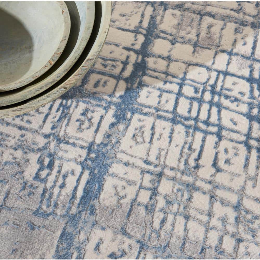 Ivory Blue Abstract 5' x 7' Synthetic Area Rug