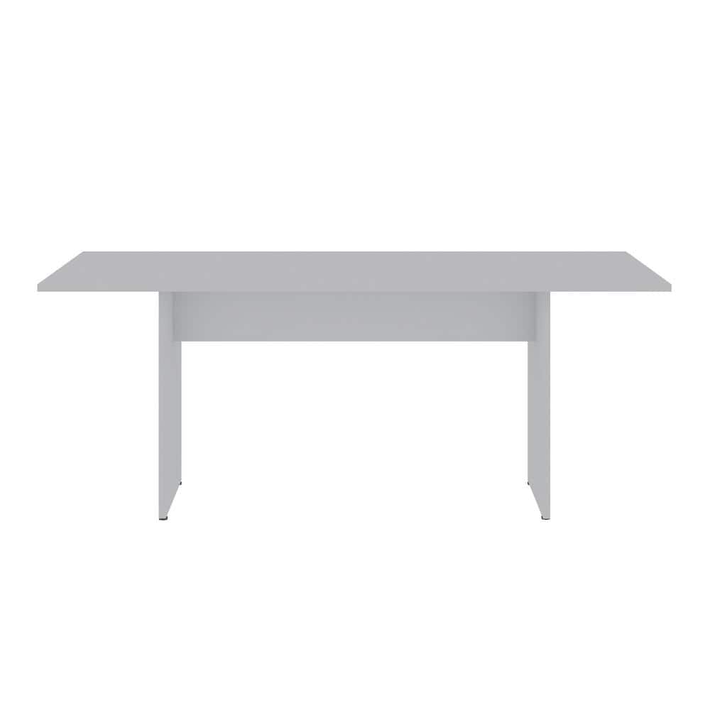 Front view of a white modern dining table.