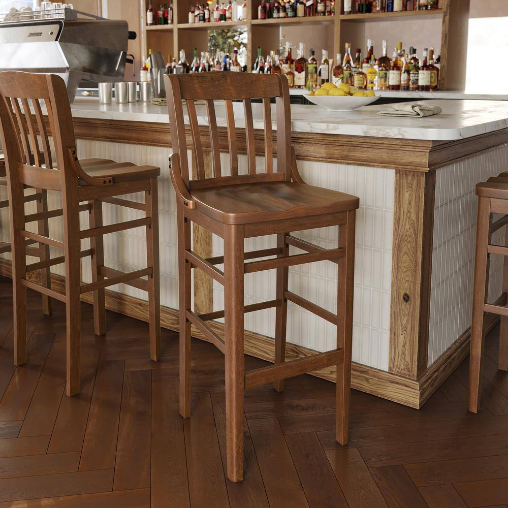 Walnut mid-back wood bar stools at a bar counter.