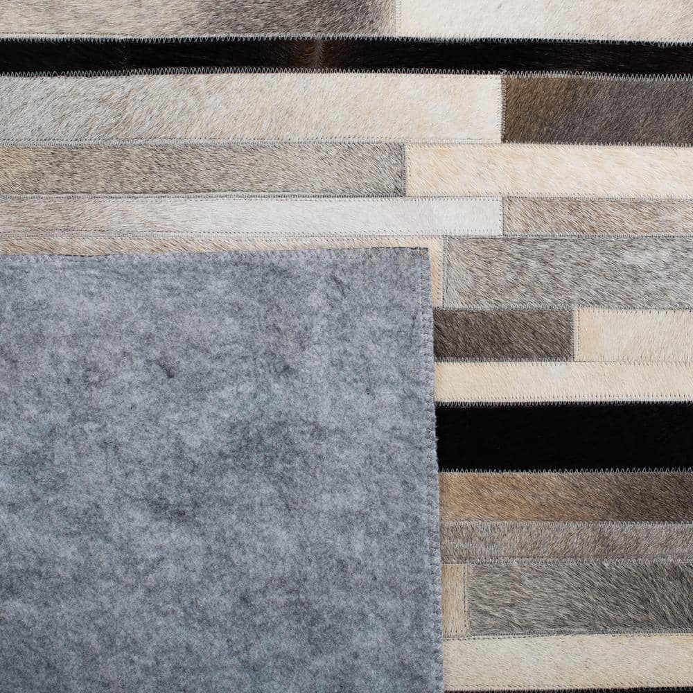Handmade Black and Ivory Geometric Cowhide Area Rug