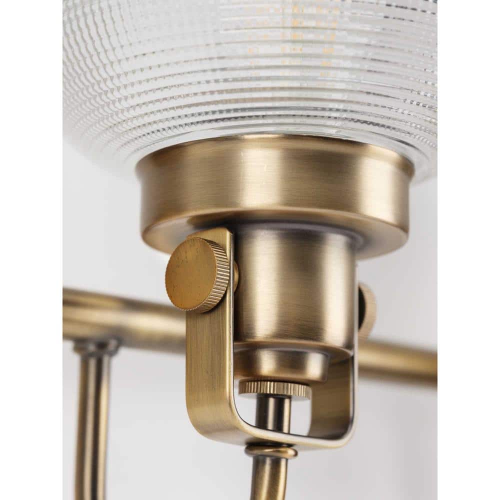 Vintage Brass Four-Light Bathroom Vanity Fixture with Prismatic Glass Shades