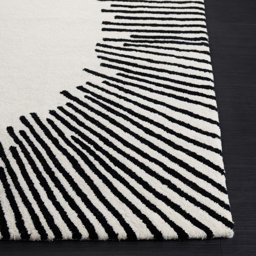 Handmade Tufted Black and Ivory Wool Area Rug 6' x 9'