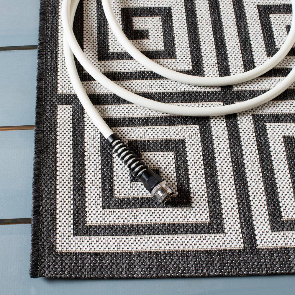 Light Grey and Charcoal Geometric 8' x 10' Synthetic Area Rug