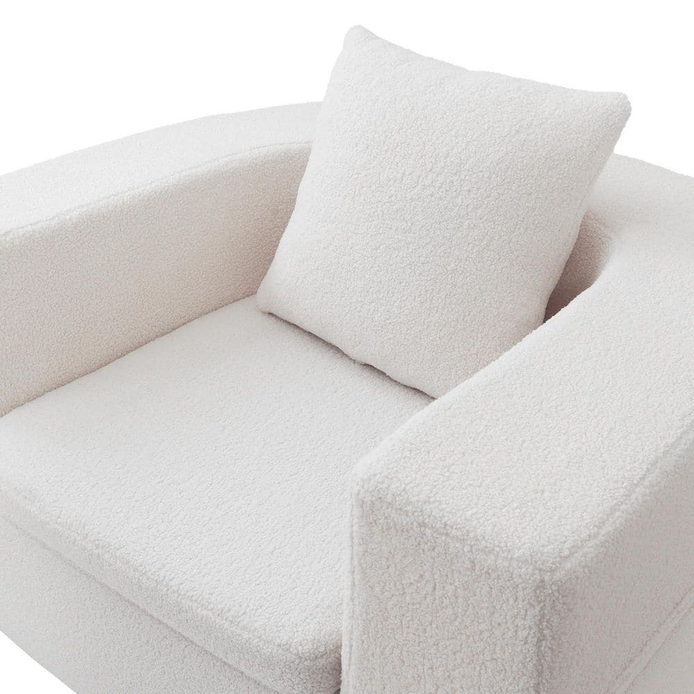 Close-up of the white teddy velvet texture on an armchair and pillow.