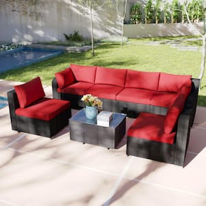 7-Piece Black Wicker Outdoor Sectional Set with Red Cushions and Coffee Table