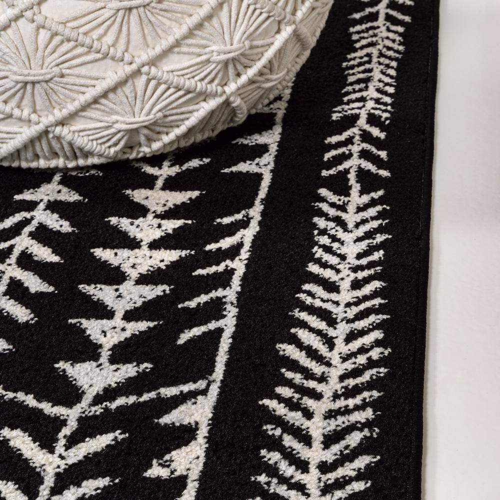 3' x 5' Black and Cream Synthetic Moroccan Geometric Area Rug