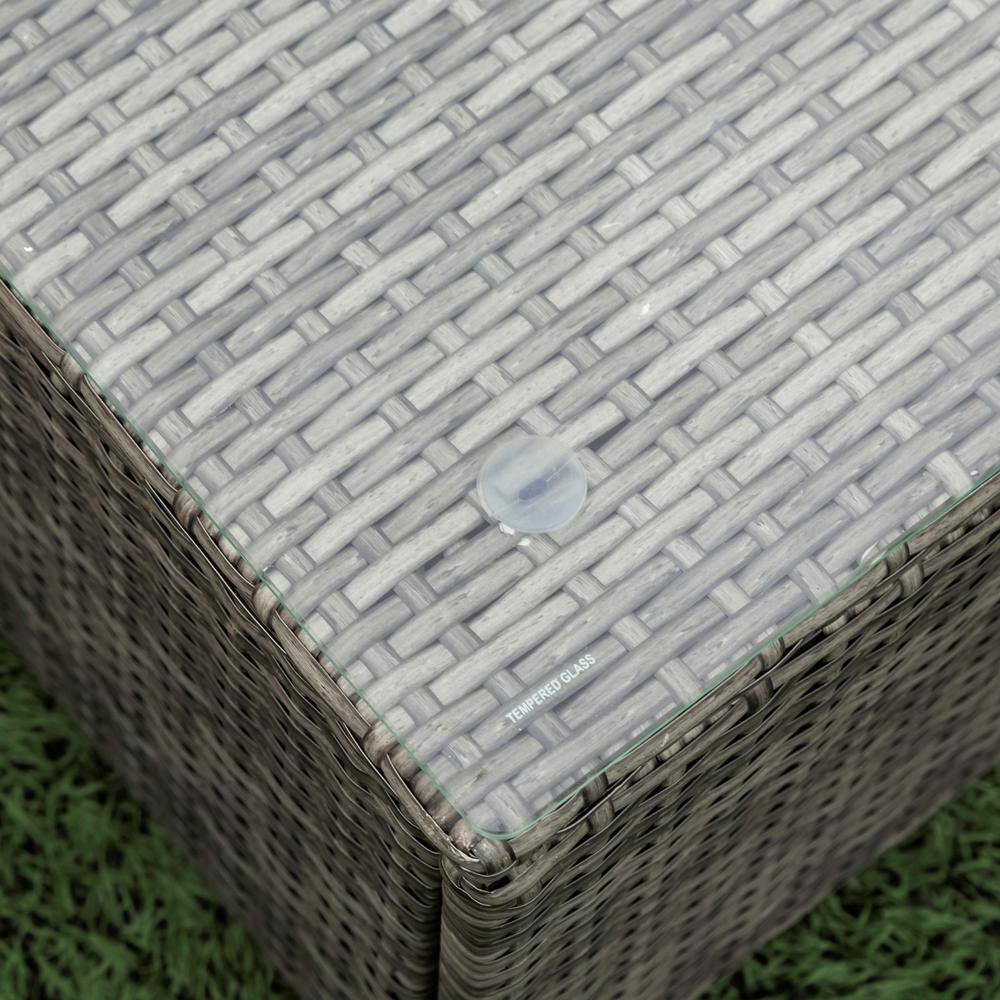 Close-up of the tempered glass top on a wicker coffee table.