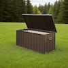 Open dark brown storage box on a green grassy lawn.